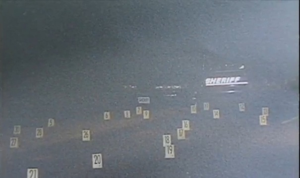 Numbered placards indicating where shell casings landed during the gunfight